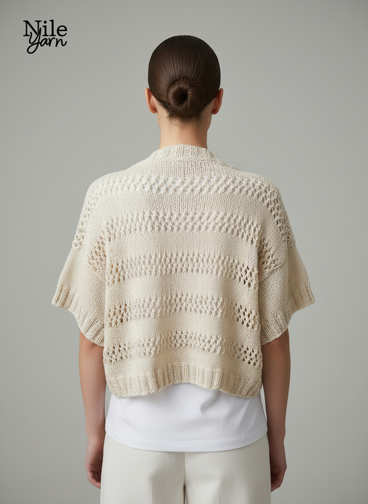 Rear view of a cropped cream knitted vest showing a consistent horizontal lace pattern and ribbed hem.