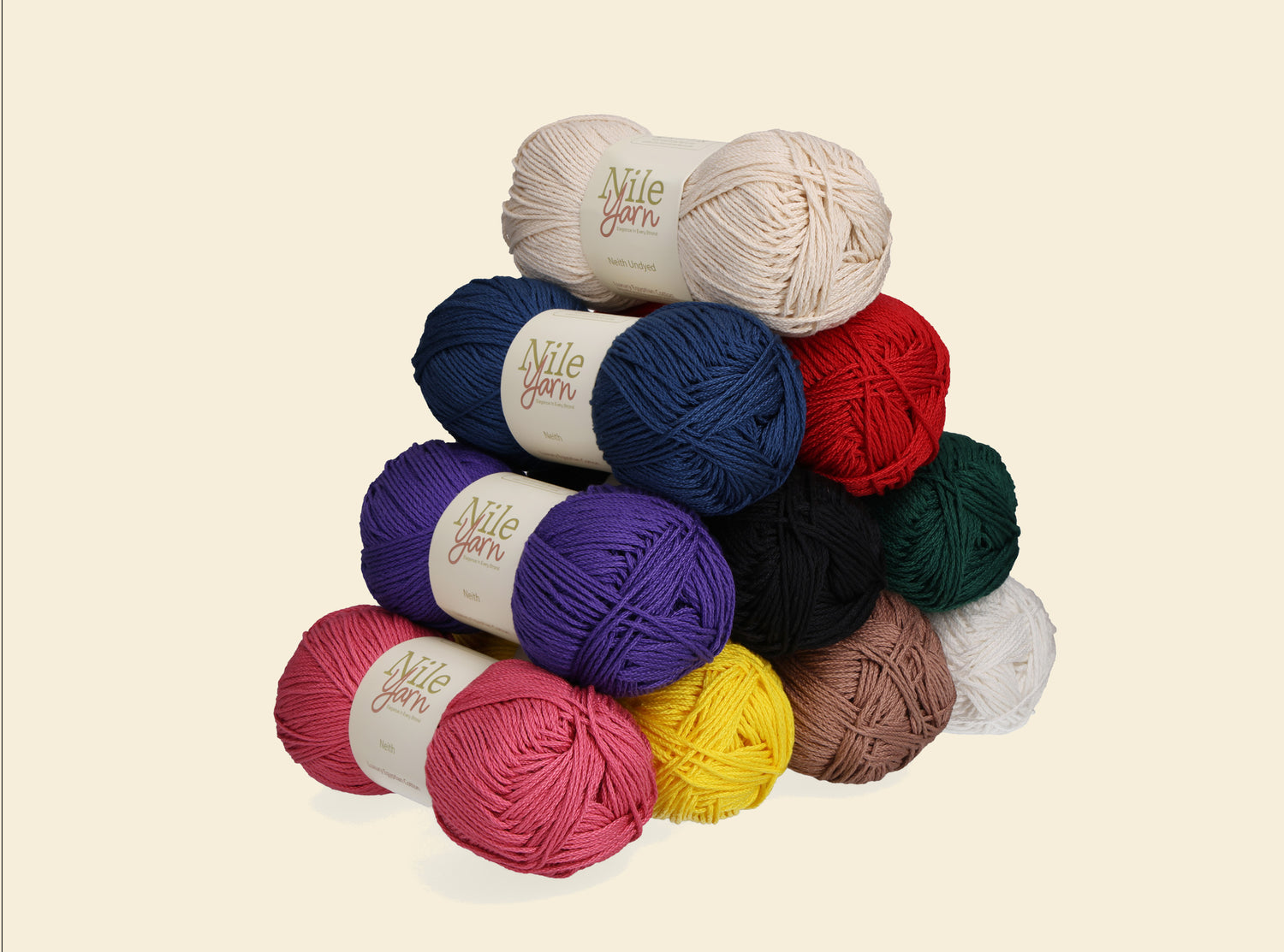 Colorful yarn balls with 'Nile Yarn' label on a beige background