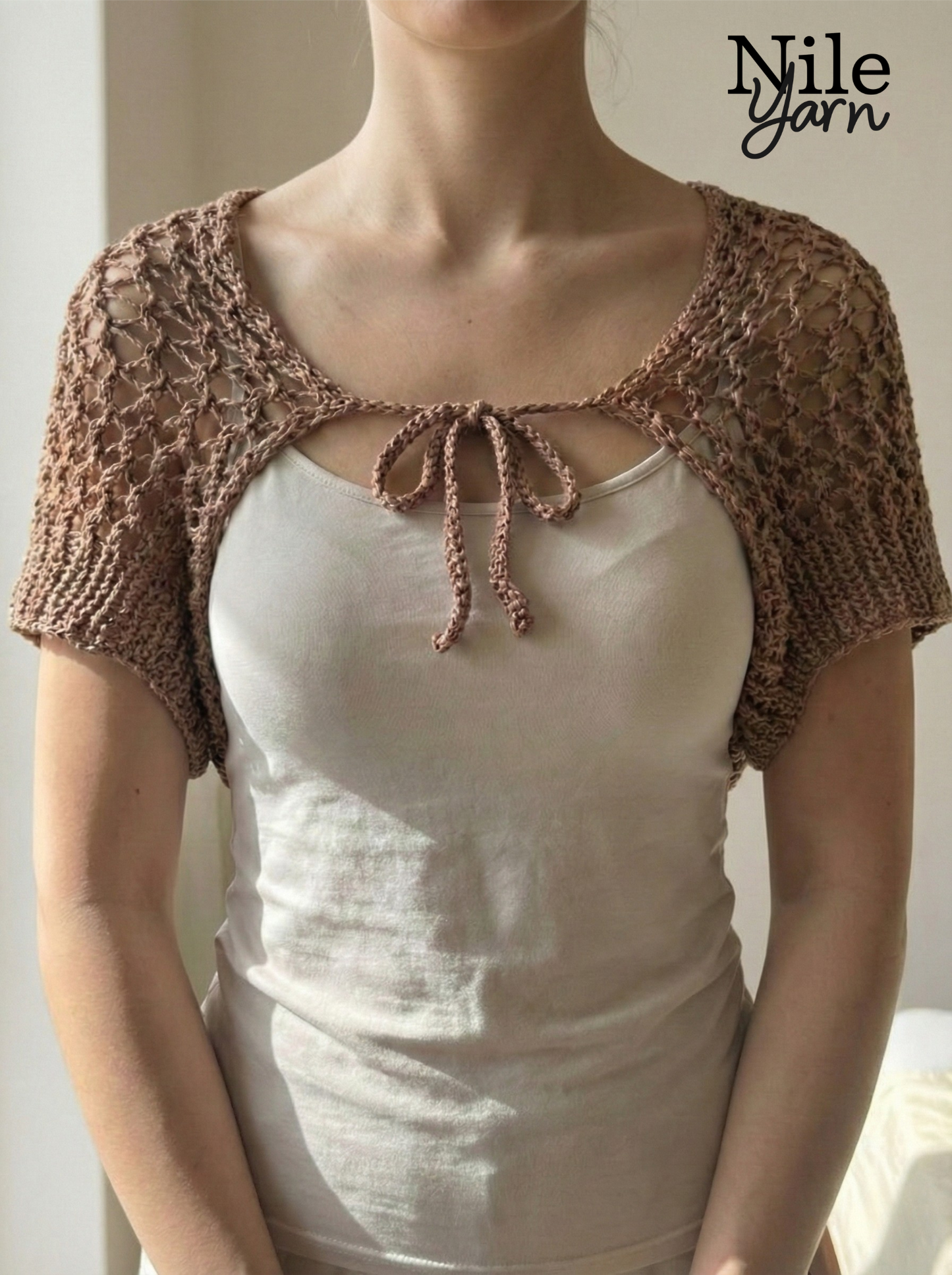 A women wearing Nile yarn shrug in  mocha mousse color 