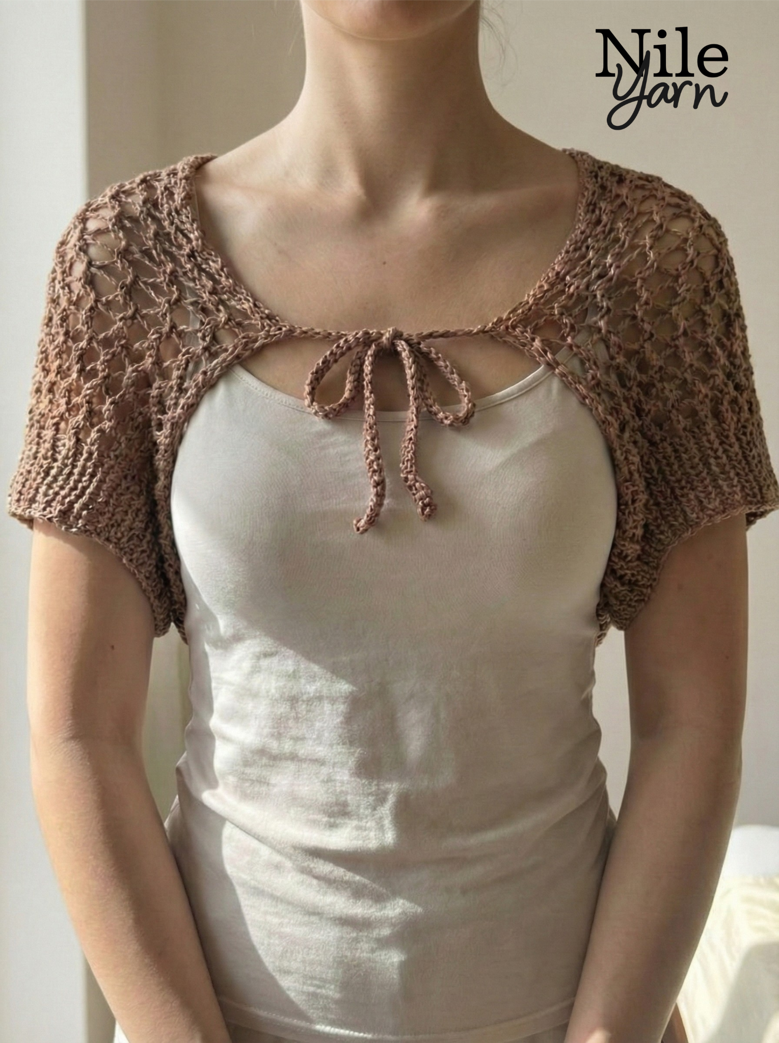 A women wearing Nile yarn shrug in  mocha mousse color 
