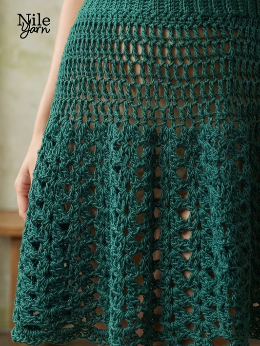 Close-up of a green crochet skirt with 'Nile Yarn' branding.